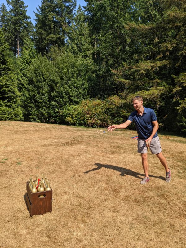 guest playing bottle ring toss